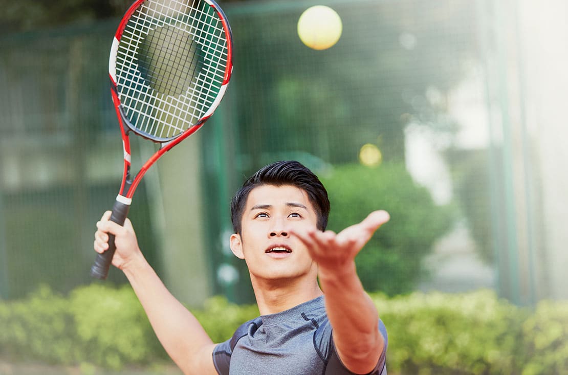 Playing tennis
