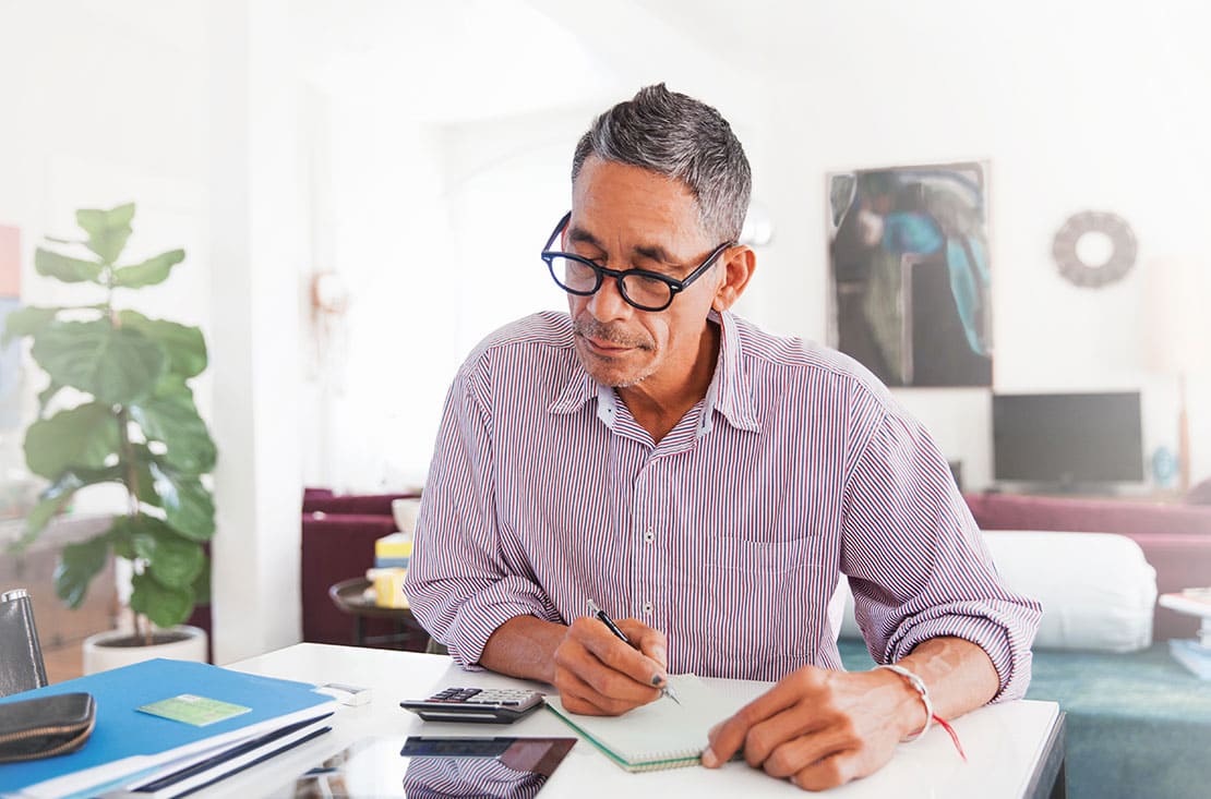 Elderly man studying