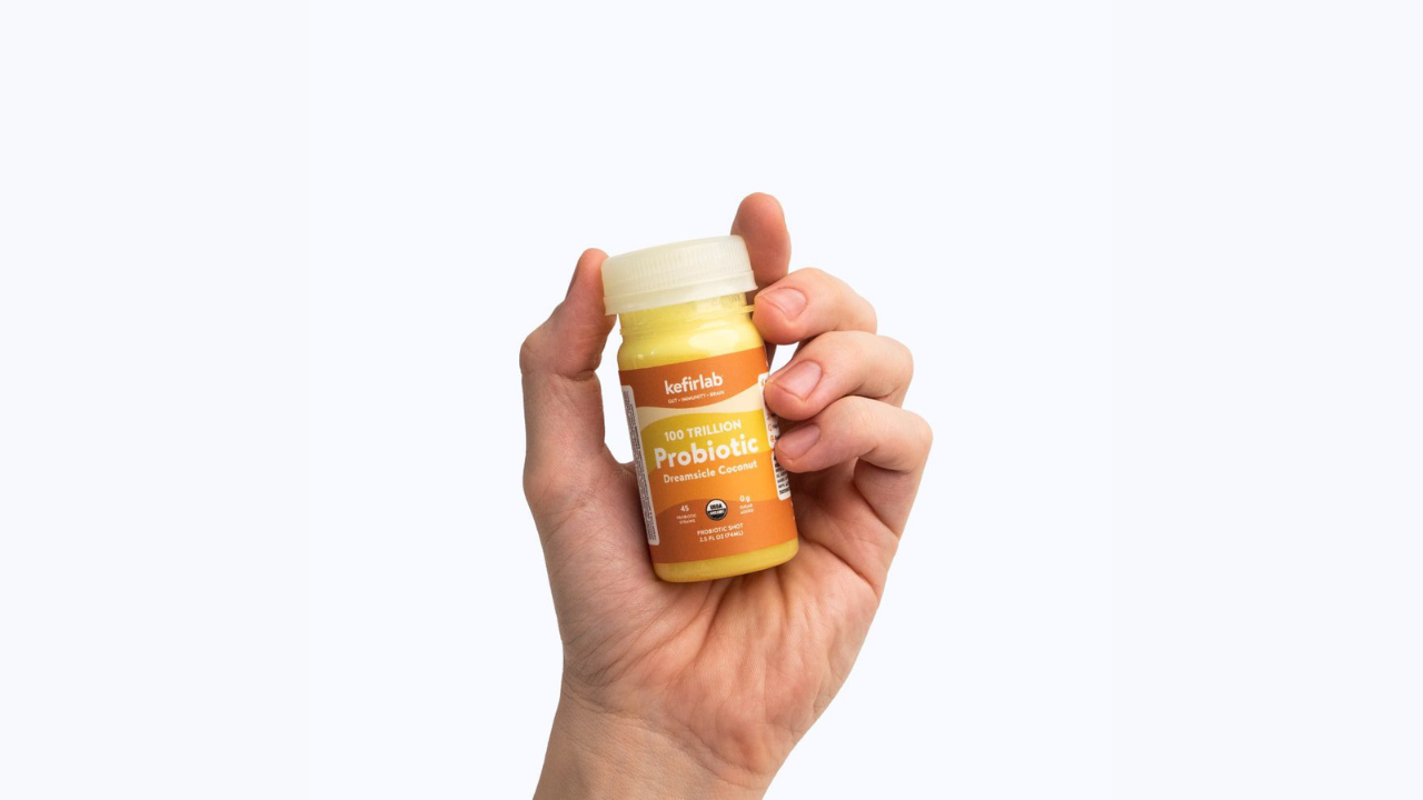 Kefirlab Dreamsicle Probiotic Shot with Hand
