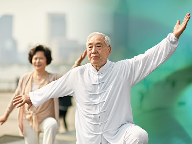 Asian couple doing taichi